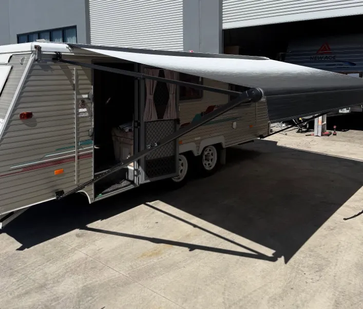 Technician repairing a Carefree RV awning