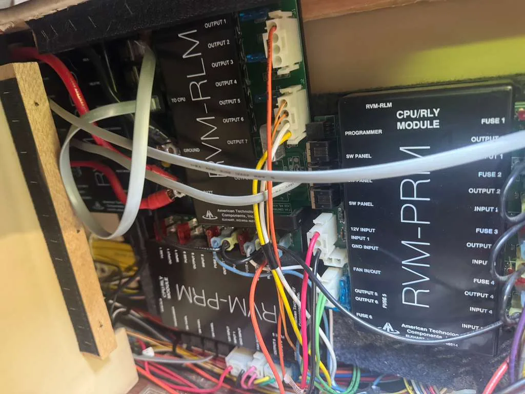 RV technician diagnosing an electrical panel fault